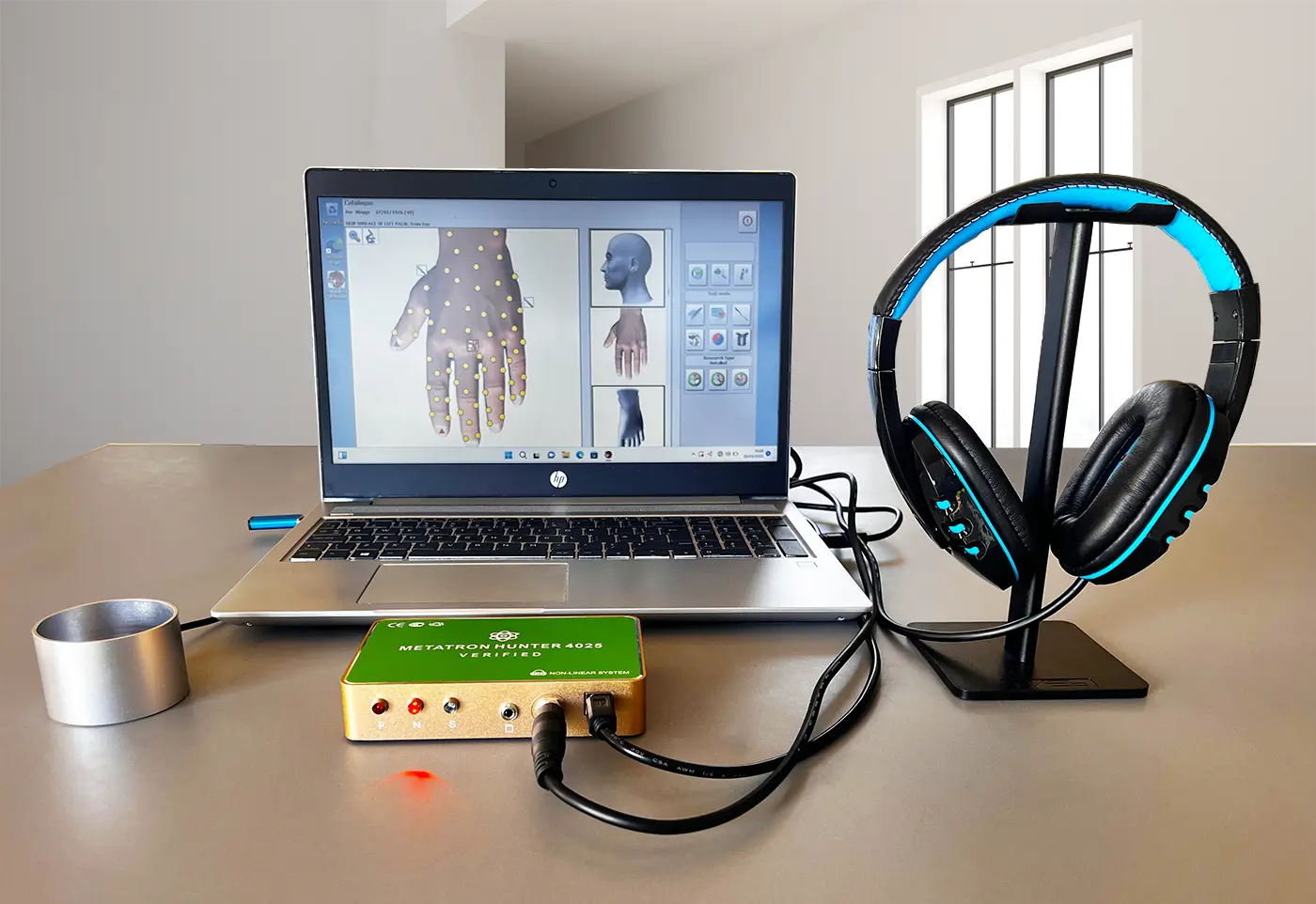 Metatron Hunter 4025 Verified connected to a laptop and bioresonance headphones during a non-invasive wellness frequency session